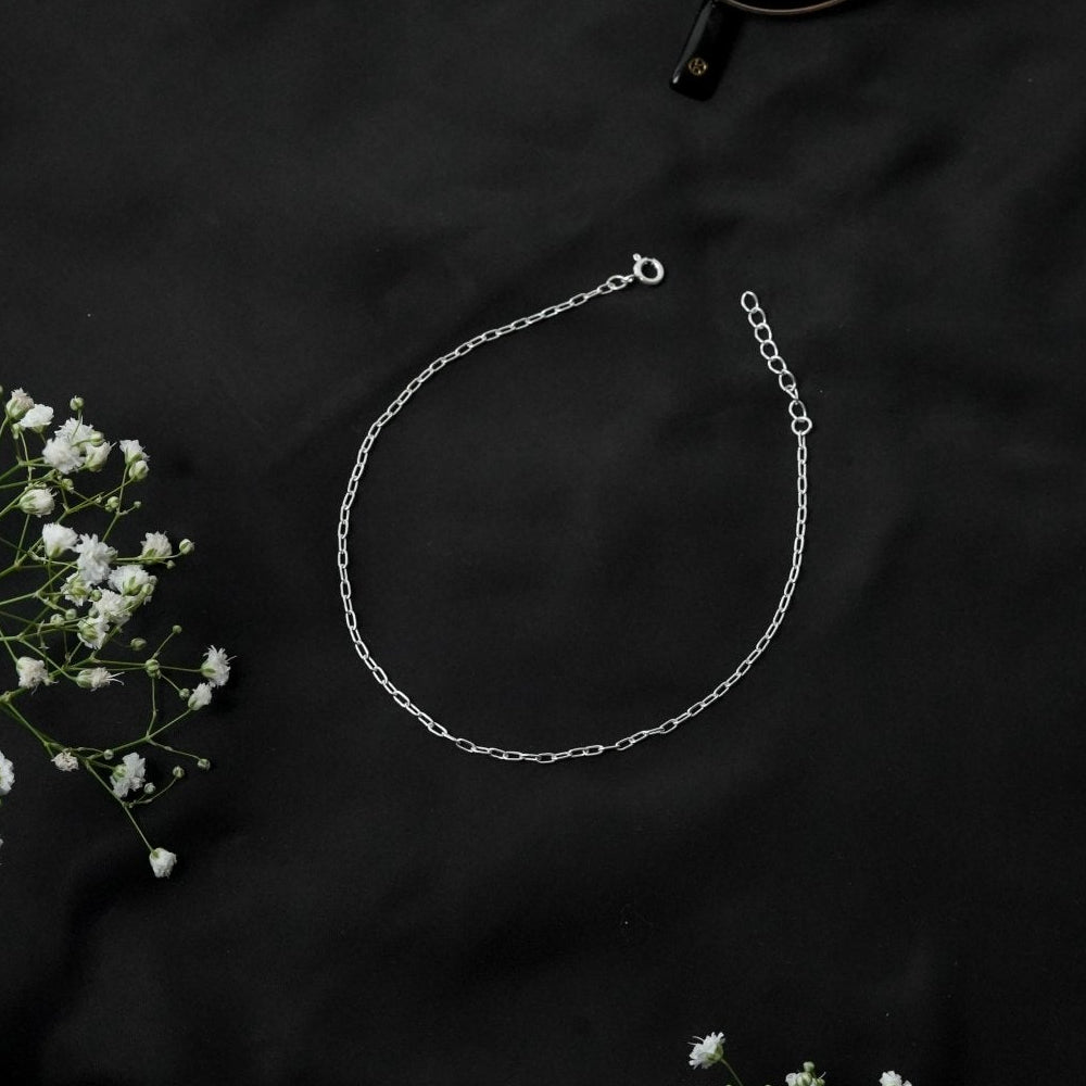 925 silver lightweight payal for girls secure with lobster lock with black background corner white flower.